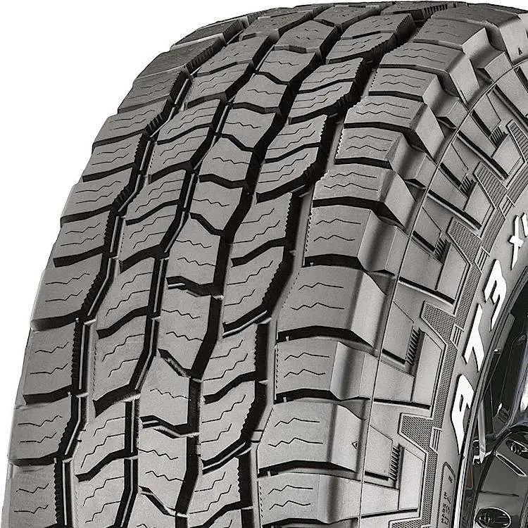 Image of Cooper Discoverer AT3 XLT tire. A heavy-duty all-terrain tire designed for overlanding, offering robust construction, strong gravel and loose dirt traction, and durable tread for long-lasting performance under heavy loads.