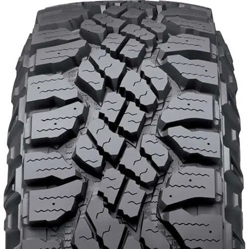 Goodyear Wrangler Duratrac tire. An aggressive all-terrain tire designed for excellent traction in snow and loose terrain, with TractiveGroove Technology and the option to add studs for extreme winter conditions