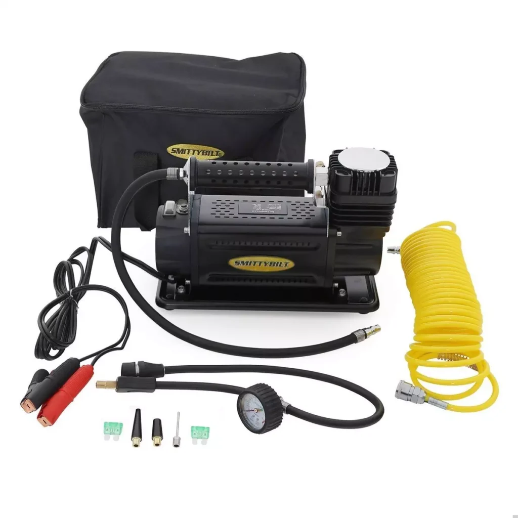 Smittybilt 2781 Compact Air Compressor: Portable air compressor with a maximum pressure of 150 PSI, featuring a compact design, 16-foot air hose, and a built-in pressure gauge.